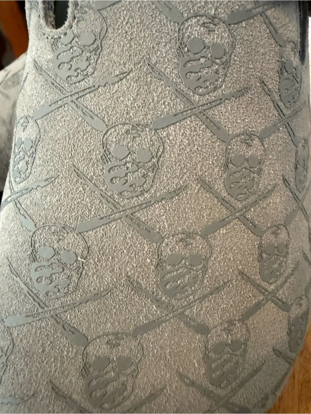 Men's SRGN mule in grey by The Surgeon with skull and crossbones pattern.
